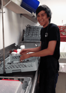 A Youth Worker Washing Dishes: Youth Job Connection Program